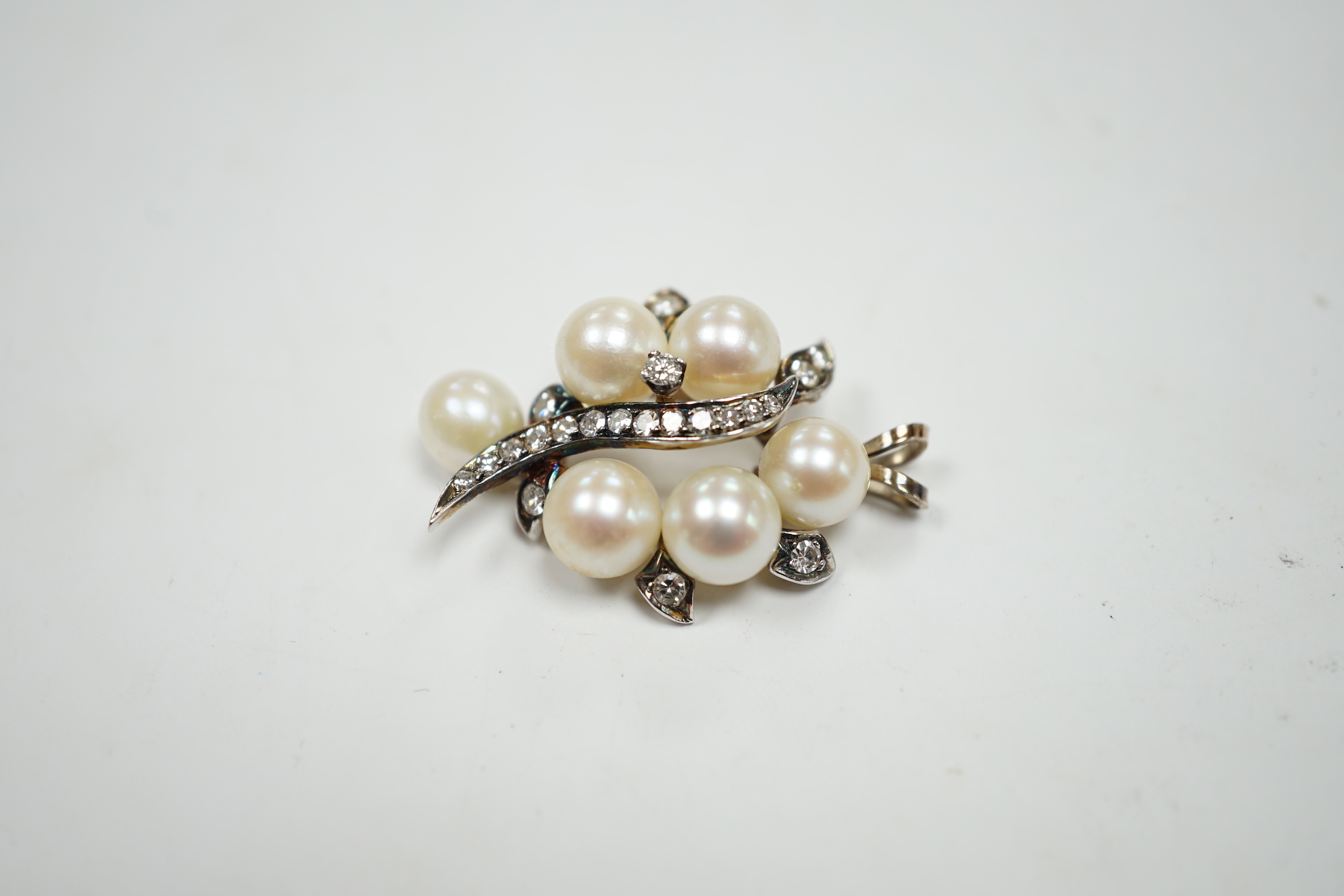A yellow and white metal, cultured pearl and diamond cluster set spray pendant, 33mm, gross weight 6.1 grams.